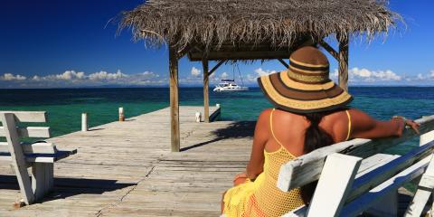 Woman overlooking beach on dock